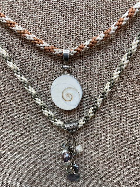 01-11-24 Basic Kumihimo Eight strands of fiber braided on a disc to make a necklace. Karen 10:30-12:30pm